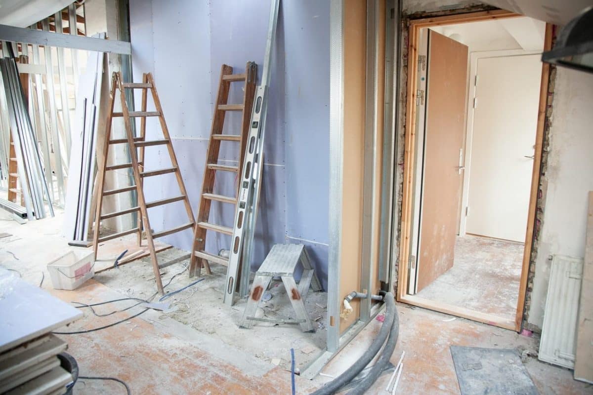 An interior of a home under renovation showing construction equipment