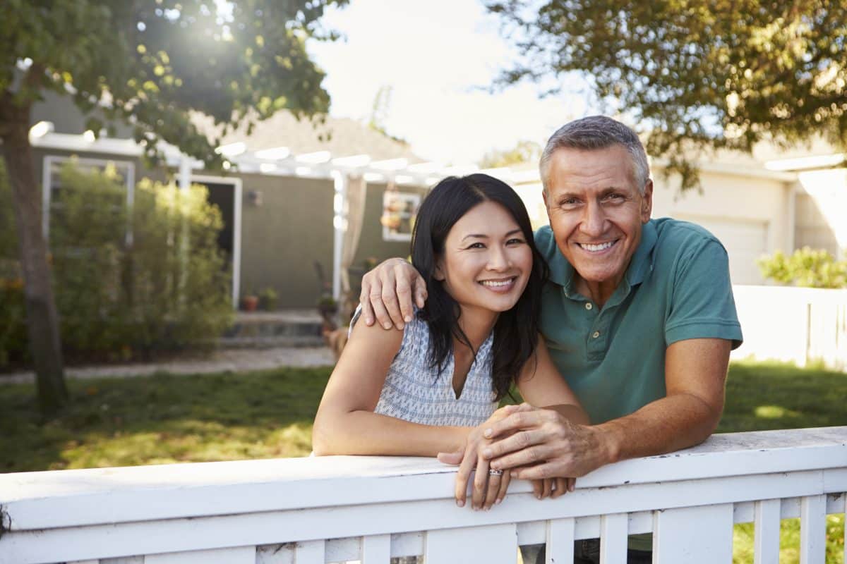 Mature couple enjoying homeownership after paying off their mortgage
