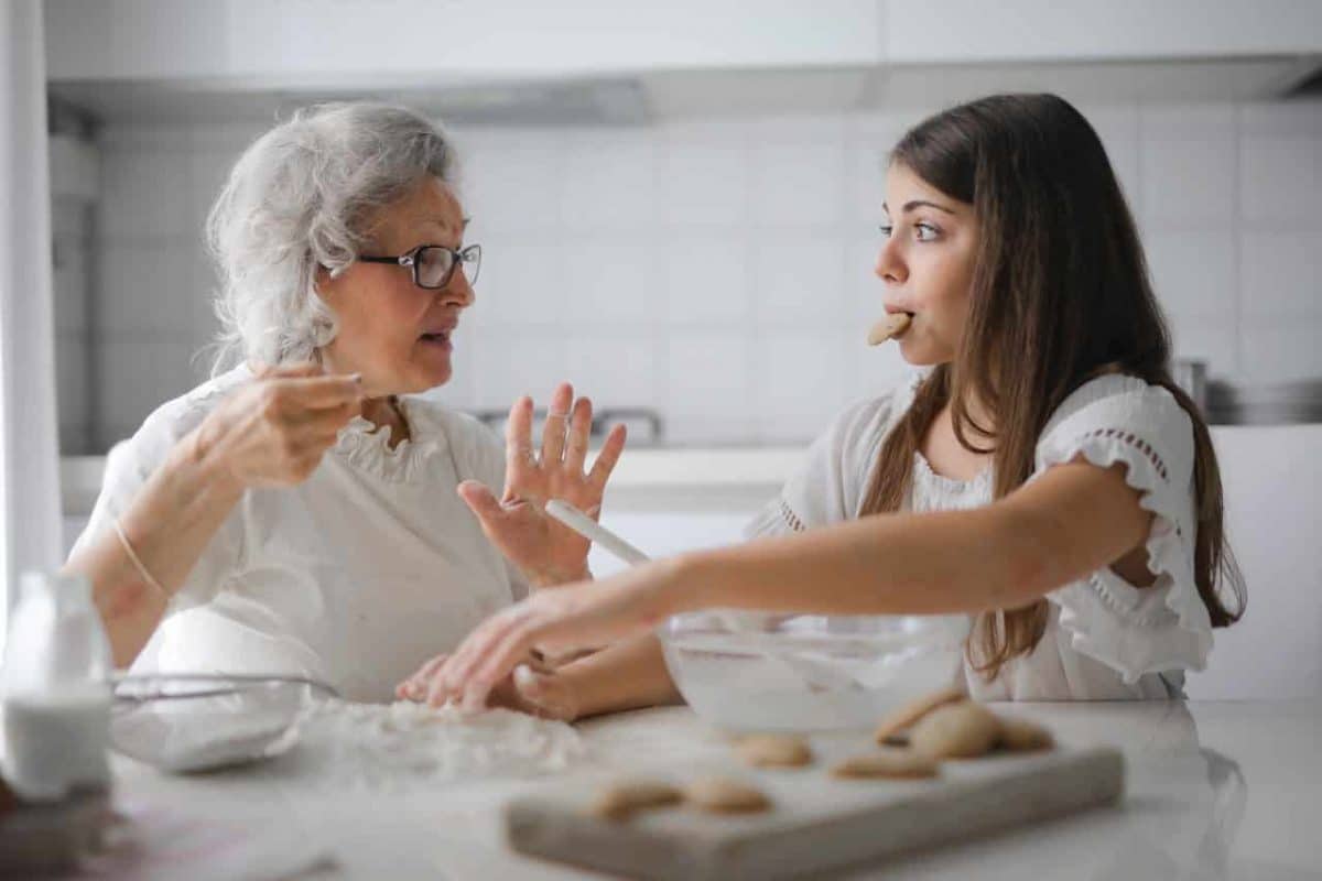 A senior and her granddaughter in the kitchen