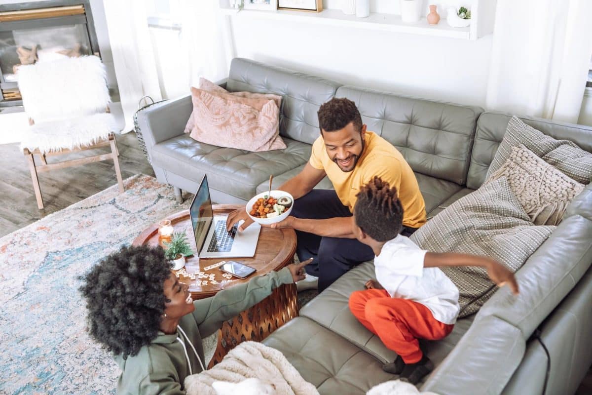 Family in their living room after refinancing their home
