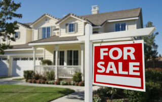 Home For Sale Sign in Front of New House.