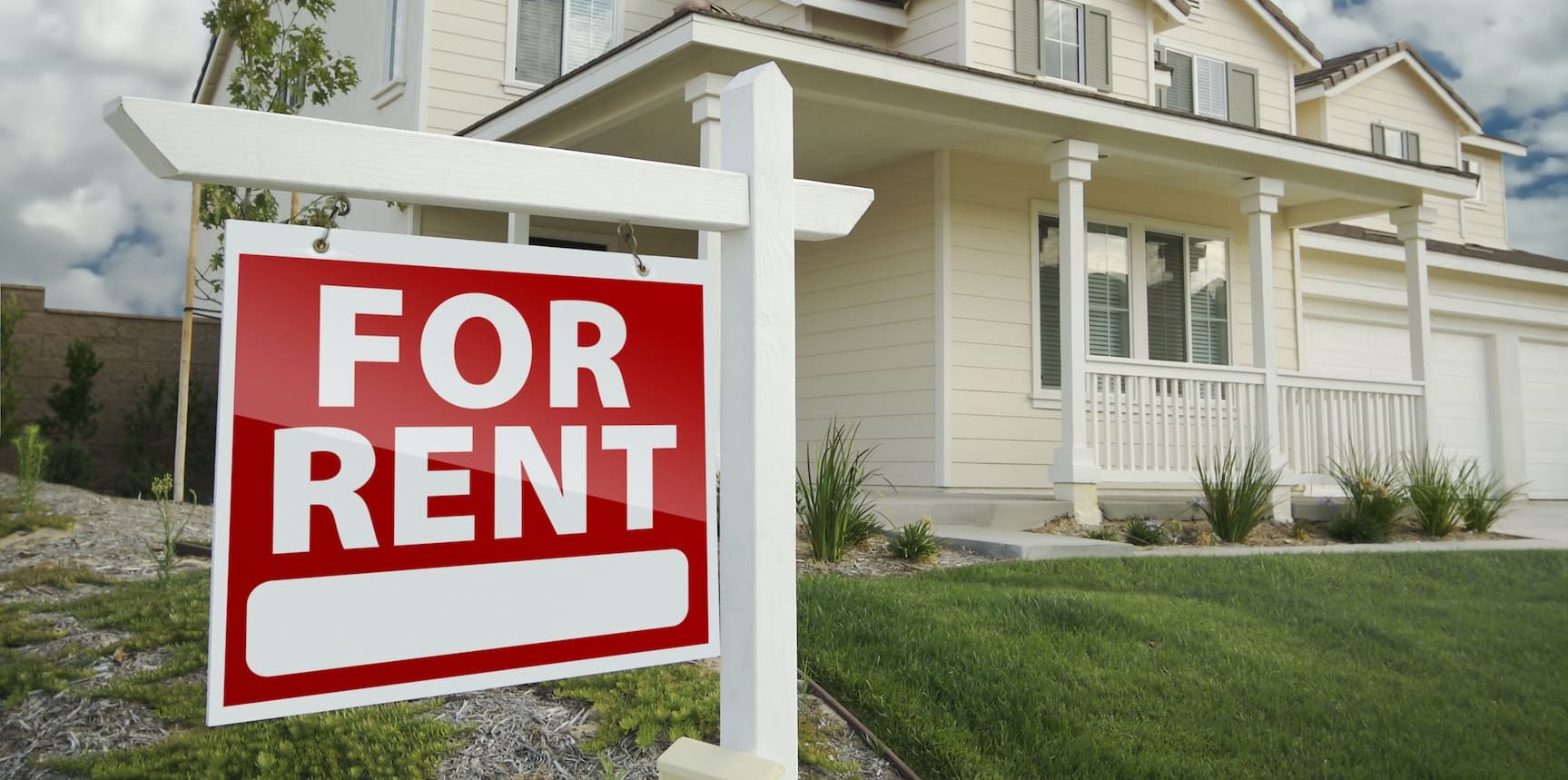 Right Facing Red For Rent Real Estate Sign in Front of Beautiful House.